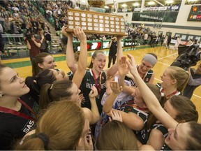 The University of Saskatchewan Huskies women's basketball team celebrate after defeating the University of Regina Cougars in the Canada West final Saturday at the PAC. (Liam Richards/Saskatoon StarPhoenix)