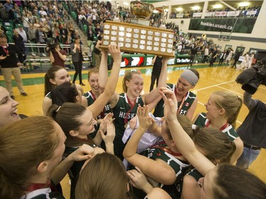 The University of Saskatchewan Huskies women's basketball team cheers as they defeat the University of Regina Cougars in the Canada West final in CIS action, March 12, 2016.