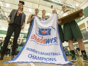 The University of Saskatchewan Huskies women's basketball team cheer as they defeat the University of Regina Cougars in the Canada West final in CIS action on Saturday, March 12th, 2016.