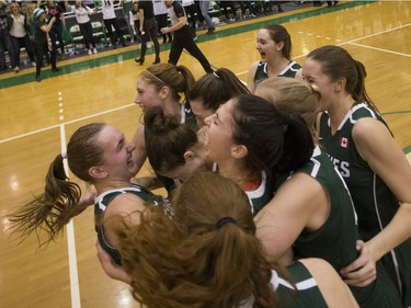 The University of Saskatchewan Huskies women's basketball team cheer as they defeat the University of Regina Cougars in the Canada West final in CIS action on Saturday, March 12th, 2016.