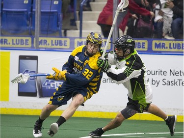 Saskatchewan Rush transition Jeremy Thompson puts some pressure on Georgia Swarm forward Shayne Jackson in NLL Lacrosse action on Saturday, March 12th, 2016.