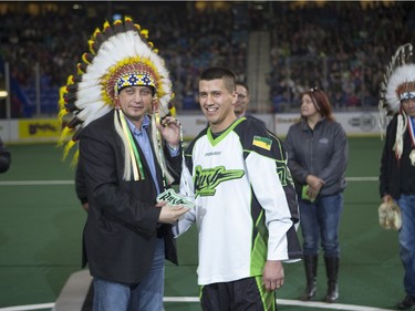 Saskatchewan Rush transition Jeremy Thompson is given a gift in honour of Aboriginal day prior to the Saskatchewan Rush taking on the Georgia Swarm in NLL Lacrosse action on Saturday, March 12th, 2016.