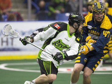 Saskatchewan Rush forward Ben McIntosh moves the ball against the Georgia Swarm in NLL Lacrosse action on Saturday, March 12th, 2016.