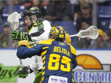 Saskatchewan Rush forward Mark Matthews Georgia battle with Georgia Swarm forward Randy Staats in NLL Lacrosse action on Saturday, March 12th, 2016.