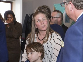 Sheri Radoux, whose daughter Emma will benefit from the autism funding, chats with Sask. Party leader Brad Wall.