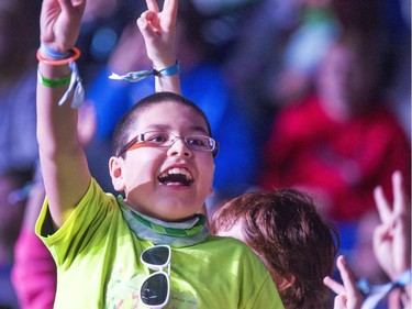 A salute to each other in SaskTel Centre with 13,000 schoolchildren, teachers and parents celebrating WeDay in Saskatoon, March 2, 2016.