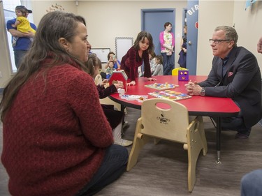 Sask Party leader Brad Wall greets parents and children at the Ability In Me (AIM) Centre, March 21, 2016.