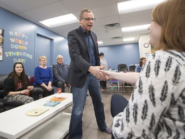 Sask Party leader Brad Wall greets parents and children at the Ability In Me (AIM) Centre, March 21, 2016.