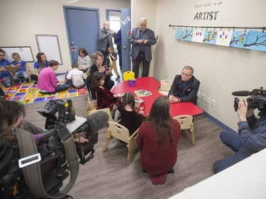 Sask Party leader Brad Wall greets parents and children at the Ability In Me (AIM) Centre, March 21, 2016.