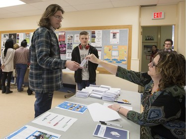 Teacher Lori Flath explained the voting process for Nutana High School students who then cast their ballots during voting day for high school students across the province with the upcoming provincial election, March 23, 2016.