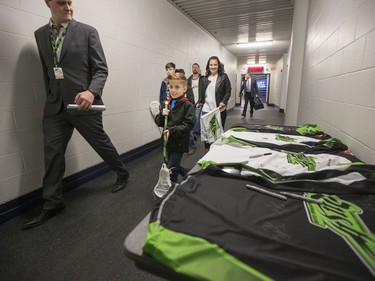 Nine-year-old Cohyn Wells enters SaskTel Centre prior to signing a one-day contract with the Saskatchewan Rush, March 26, 2016. Wells is the Saskatchewan representative for the Children's Miracle Network's Champion Program.
