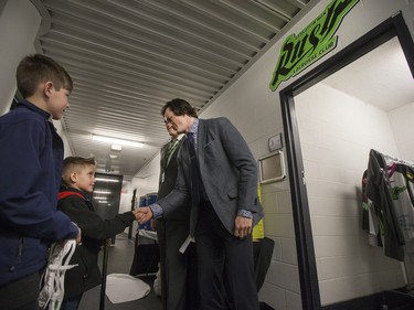 Saskatchewan Rush captain Chris nine-year-old Cohyn Wells prior to signing a one-day contract with the Saskatchewan Rush, March 26, 2016. Wells is the Saskatchewan representative for the Children's Miracle Network's Champion Program.
