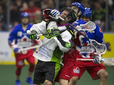 Saskatchewan Rush forward Zack Greer makes a pass against the Toronto Rock in NLL action, March 26, 2016.