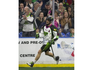 Saskatchewan Rush forward Zack Greer and fans celebrate a goal against the Toronto Rock in NLL action, March 26, 2016.