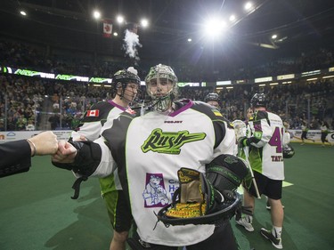 Saskatchewan Rush goalie Aaron Bold and his teammates celebrate their win over the Toronto Rock in NLL action, March 26, 2016.