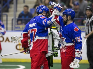 Toronto Rock forward Stephan Leblanc (L) and forward Turner Evans celebrate a goal against the Saskatchewan Rush in NLL action, March 26, 2016.