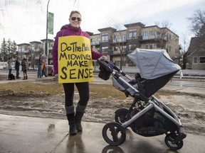 Lindsay Janzen poses for a photograph while attending a midwives rally at the Memorial Archway on College Drive on Saturday, March 5th, 2016.