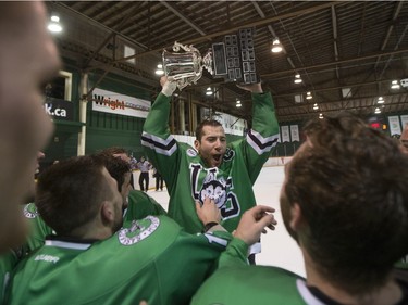 The University of Saskatchewan Huskies celebrate after defeating the University of Alberta Golden Bears to win the CIS Men's Hockey Canada West championship on Saturday, March 5th, 2016.