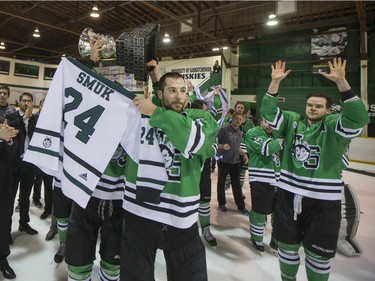 The University of Saskatchewan Huskies celebrate after defeating the University of Alberta Golden Bears to win the CIS Men's Hockey Canada West championship on Saturday, March 5th, 2016.