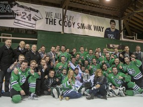 The University of Saskatchewan Huskies celebrate under the Cody Smuk banner with his family after defeating the University of Alberta Golden Bears to win the CIS Men's Hockey Canada West championship on Saturday, March 5th, 2016.