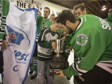 University of Saskatchewan Huskies forward Kohl Bauml brings his brother on to the ice to celebrate after defeating the University of Alberta Golden Bears to win the CIS Men's Hockey Canada West championship on Saturday, March 5th, 2016.