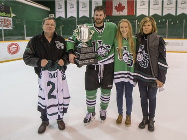 The University of Saskatchewan Huskies celebrate after defeating the University of Alberta Golden Bears to win the CIS Men's Hockey Canada West championship on Saturday, March 5th, 2016