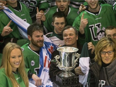 The University of Saskatchewan Huskies celebrate after defeating the University of Alberta Golden Bears to win the CIS Men's Hockey Canada West championship on March 5, 2016.