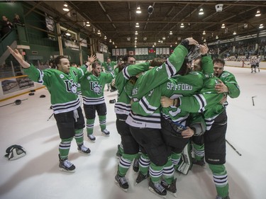 The University of Saskatchewan Huskies celebrate after defeating the University of Alberta Golden Bears to win the CIS Men's Hockey Canada West championship on Saturday, March 5th, 2016