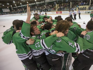 The University of Saskatchewan Huskies celebrate after defeating the University of Alberta Golden Bears to win the CIS Men's Hockey Canada West championship on Saturday, March 5th, 2016.