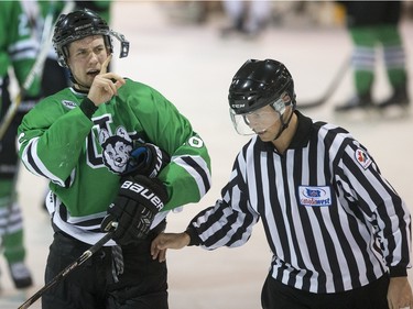 University of Saskatchewan Huskies forward Jesse Ross is confused by his broken visor after an altercation against the University of Alberta Golden Bears in third period CIS Men's Hockey playoff action on  March 5, 2016.