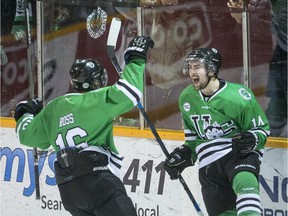 University of Saskatchewan Huskies forward Jesse Ross, left, and froward Logan McVeigh celebrate a goal against the University of Alberta Golden Bears in 3rd period CIS Men's Hockey playoff action on Saturday, March 5th, 2016.