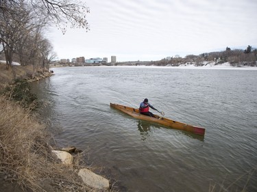 A canoeist enjoys the warm weather along the South Saskatchewan River near Victoria Park in Saskatoon, March 6, 2016.