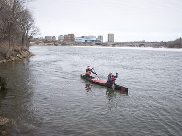 Canoeists enjoy the warm weather along the South Saskatchewan River near Victoria Park in Saskatoon, March 6, 2016.