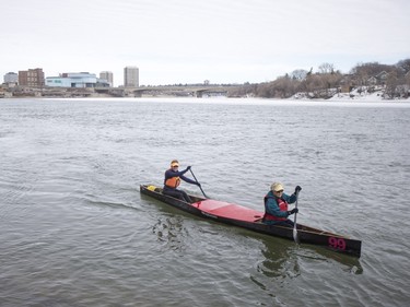 Canoeists enjoy the warm weather along the South Saskatchewan River near Victoria Park in Saskatoon, March 6, 2016.