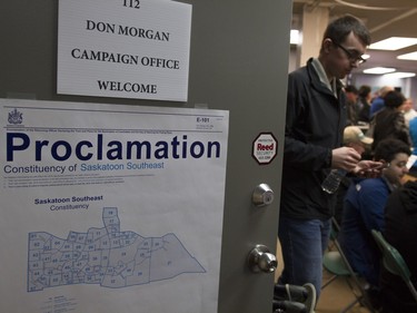 Supporters wait for the entrance of Premier Brad Wall before the revealing of the Saskatchewan Party platform at their Southeast campaign office in Saskatoon, March 19, 2016.