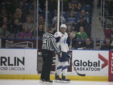 Saskatoon Blades' Lukus MacKenzie talks to the referee after a conflict with the Prince Albert Raiders during Saturday night's game at SaskTel Centre in Saskatoon where the Blades took home a 3-2 victory over the Raiders, March 19, 2016.