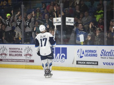 Saskatoon Blades #17 Nick Zajac celebrates with fans after Saturday night's game at SaskTel Centre in Saskatoon where the Blades took home a 3-2 victory over the Prince Albert Raiders, March 19, 2016.