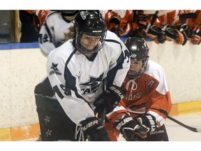 File Photo - December 14, 2014 - The Saskatoon Stars' Hollie Coumont takes on the Price Albert A&W Bears in first period action at Agri-Place West on Sunday. (Michelle Berg / The StarPhoenix)