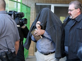 George Mitchell Allgood walks out of Court of Queen's Bench after being found guilty of murdering Susan Reinhardt and attempted murder of David Ristow in Saskatoon on Jan. 27, 2014