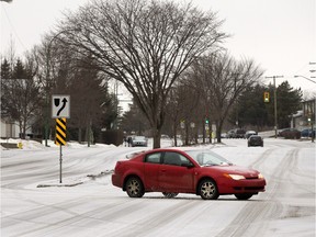 Roads in the city, like Lenore Drive in photo, were snow and ice coated after a mix of sleet and freezing rain, Monday, March 07, 2016.