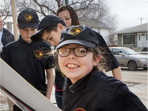 Saskatoon Police Service Cadet member Zoe Wilkinson-Laret climbs into a new Bandelero race car at a news conference announcing the Racing for Respect program for inner city youth aged 8-14 years who are members of the Saskatoon Police Service Cadet Program. The cadets will race and maintain a Bandolero race car in seven sanctioned events of the Saskatoon Stock Car Association.