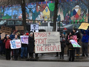 About 60 people gathered in Pleasant Hill Park to rally against the practice of police carding before marching to city hall, Tuesday, March 15, 2016. Two police service members briefly visited the rally as well. (GREG PENDER/ SASKATOON STARPHOENIX)