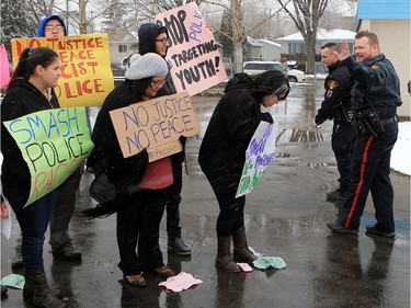 About 60 people gathered in Pleasant Hill Park to rally against the practice of police carding before marching to City Hall, March 15, 2016. Two police service members briefly visited the rally as well.