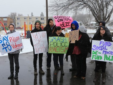 About 60 people gathered in Pleasant Hill Park to rally against the practice of police carding before marching to City Hall, March 15, 2016. Two police service members briefly visited the rally as well.