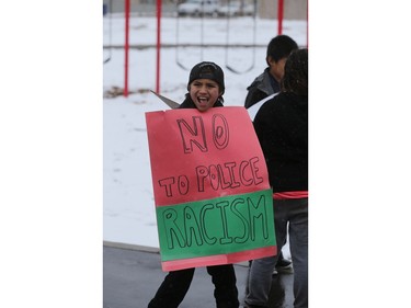 About 60 people gathered in Pleasant Hill Park to rally against the practice of police carding before marching to City Hall, March 15, 2016. Two police service members briefly visited the rally as well.