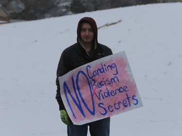 About 60 people gathered in Pleasant Hill Park to rally against the practice of police carding before marching to City Hall, March 15, 2016. Two police service members briefly visited the rally as well.