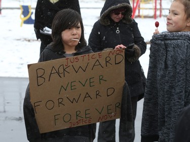 About 60 people gathered in Pleasant Hill Park to rally against the practice of police carding before marching to City Hall, March 15, 2016. Two police service members briefly visited the rally as well.