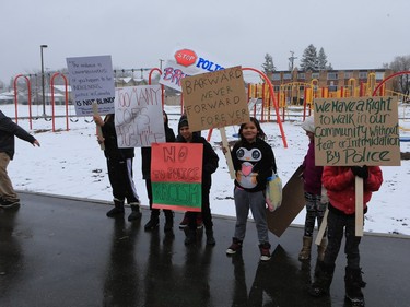 About 60 people gathered in Pleasant Hill Park to rally against the practice of police carding before marching to City Hall, March 15, 2016. Two police service members briefly visited the rally as well.