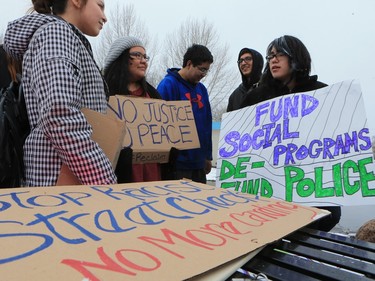 About 60 people gathered in Pleasant Hill Park to rally against the practice of police carding before marching to City Hall, March 15, 2016. Two police service members briefly visited the rally as well.