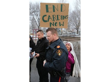 About 60 people gathered in Pleasant Hill Park to rally against the practice of police carding before marching to City Hall, March 15, 2016. Two police service members briefly visited the rally as well.